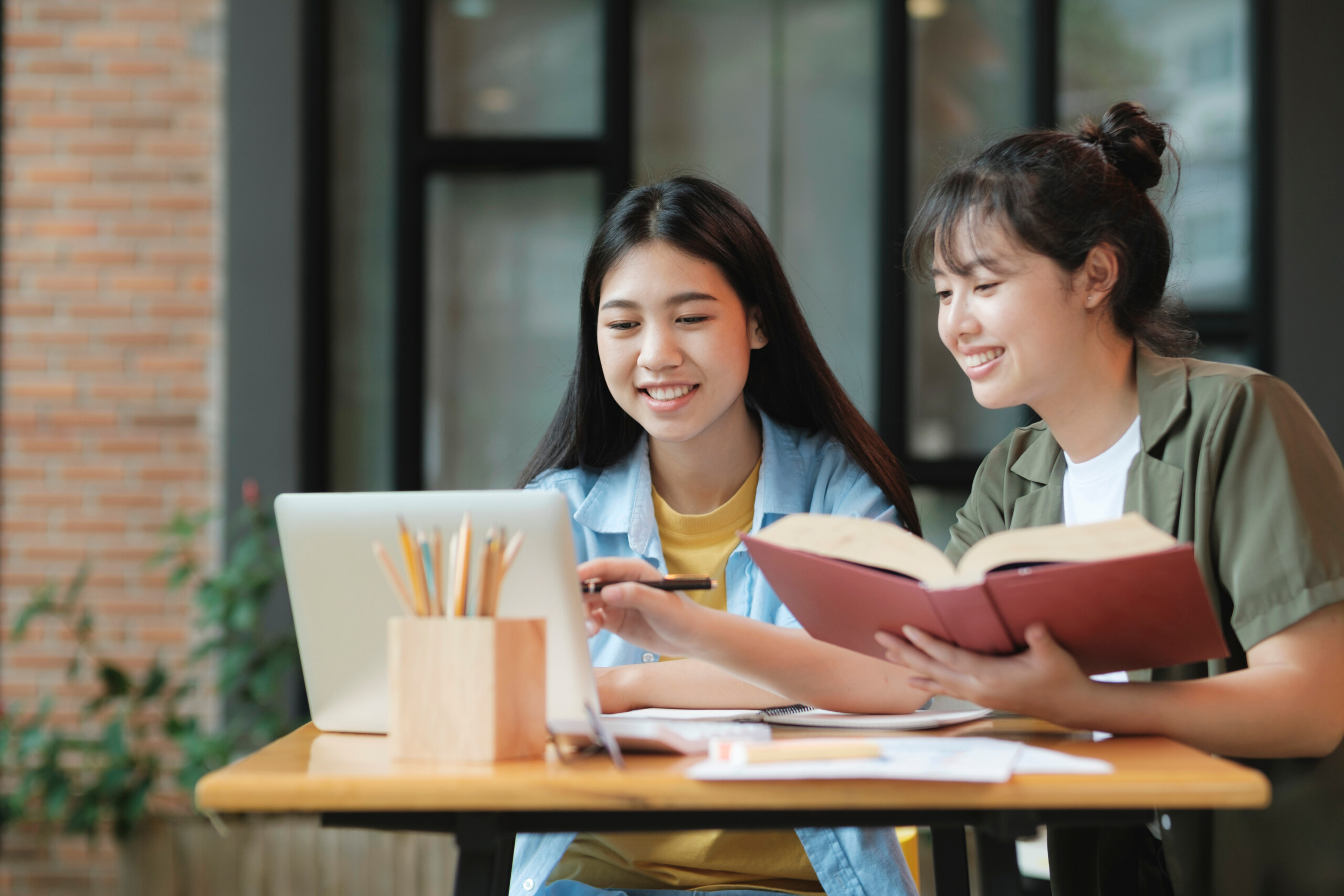 young asian students campus helps friend catching up learning